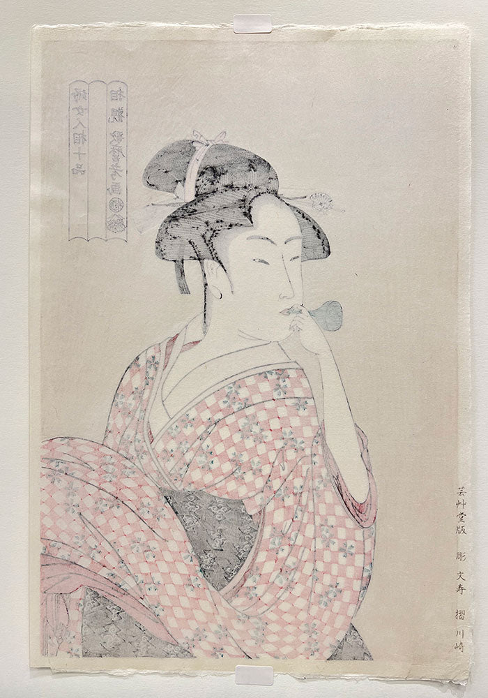 Woodblock print "Woman Playing a Poppin" by Utamaro Published by UNSODO